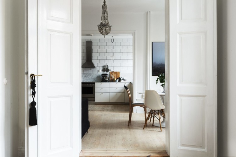 white kitchen with vintage chandeliera via frantasticfrank.se