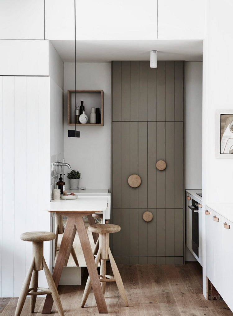 giant wooden handles on kitchen cupboards by whiting architects.com