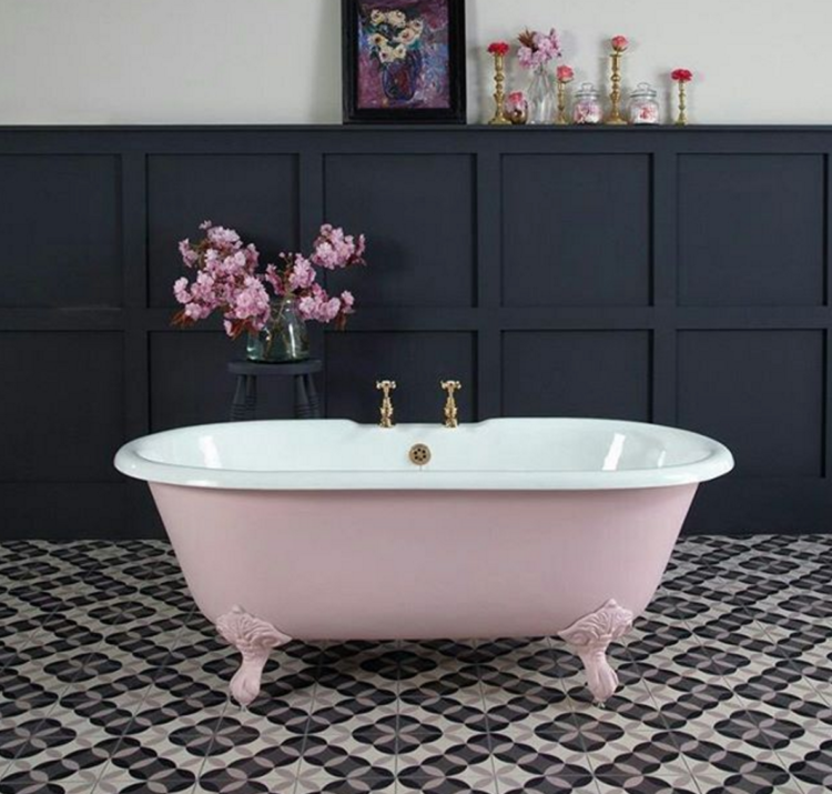 pink freestanding tub with black wall panellingpink freestanding tub with black wall panelling