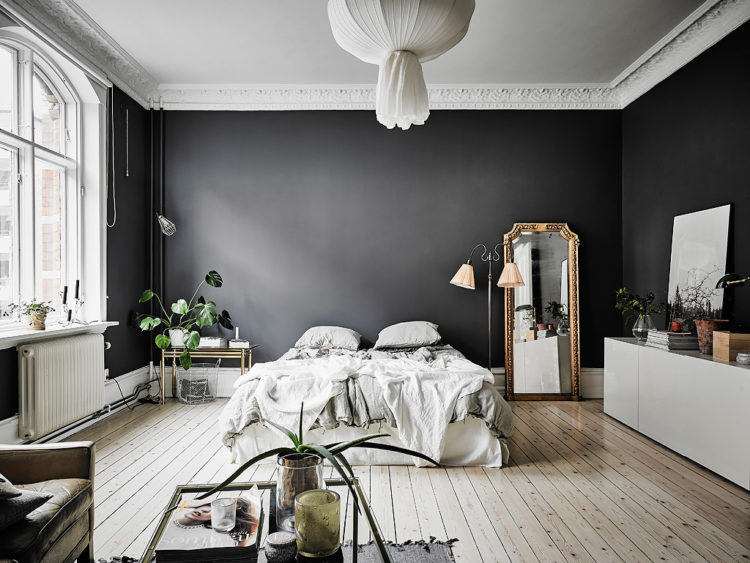 dark grey bedroom with wooden floor via entrance makleri