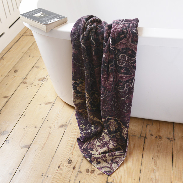 towels inspired by persian rugs with a muted colour palette.