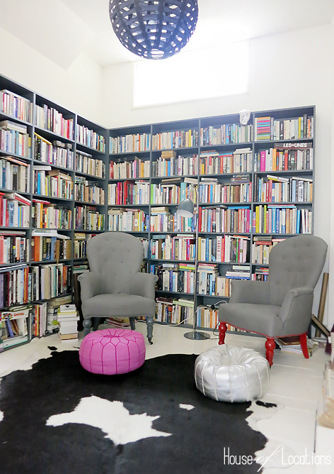 library grey shelves black and white rug monochome pink accessories