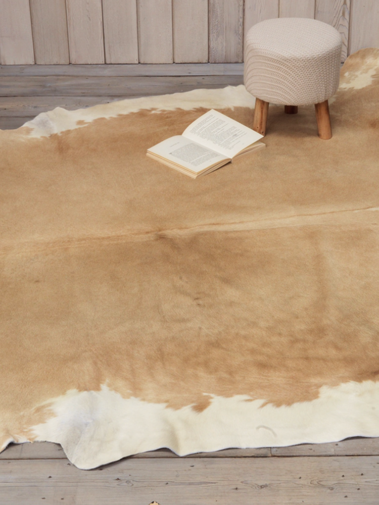 tan cowhide rug from cox and cox