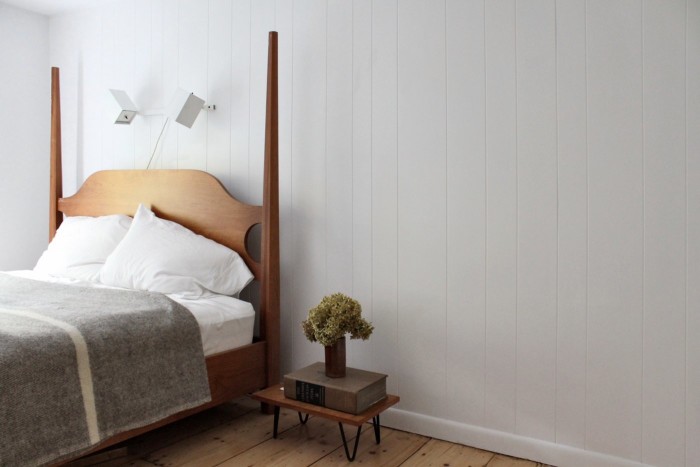white bedroom panelled walls simple from workstead