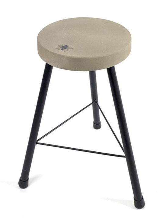 concrete stool with fly motif from hollys house