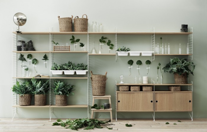 string shelving with plants and baskets