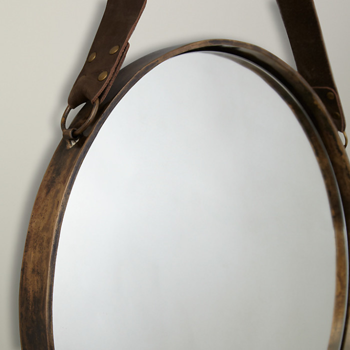 brass and leather round hanging mirror detail