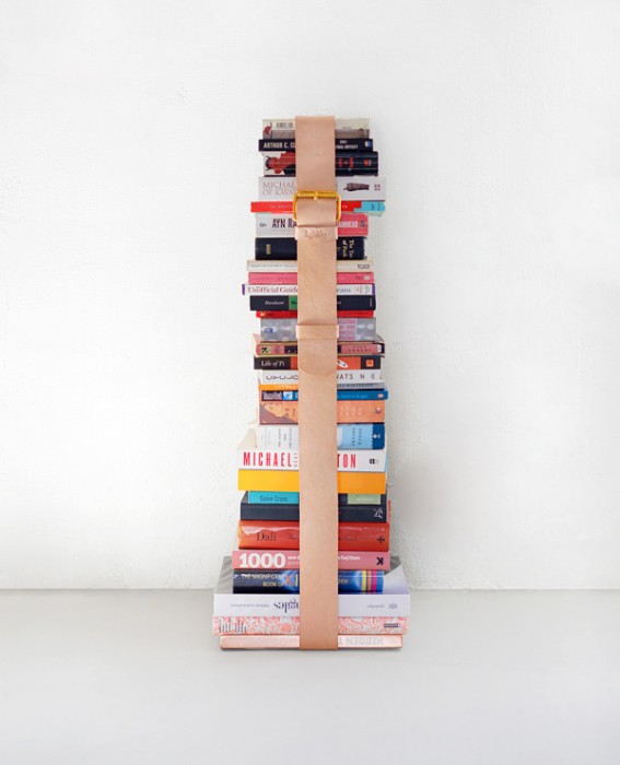 use a leather belt to keep books and magazines tidy
