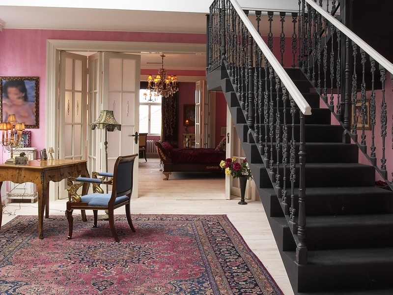 persian rug and black stairs