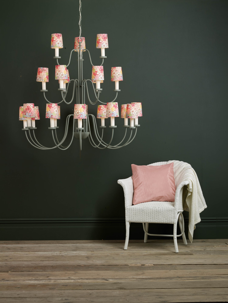 grey walls, pink chair, pendant light