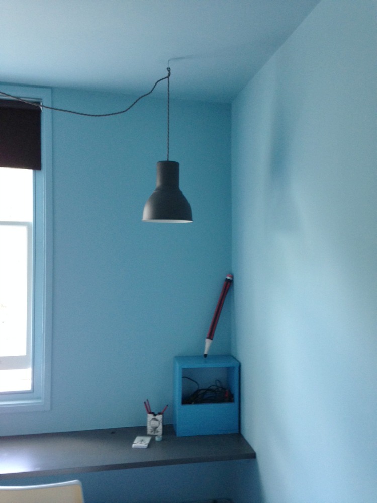 blue walls hanging pendant light black desk