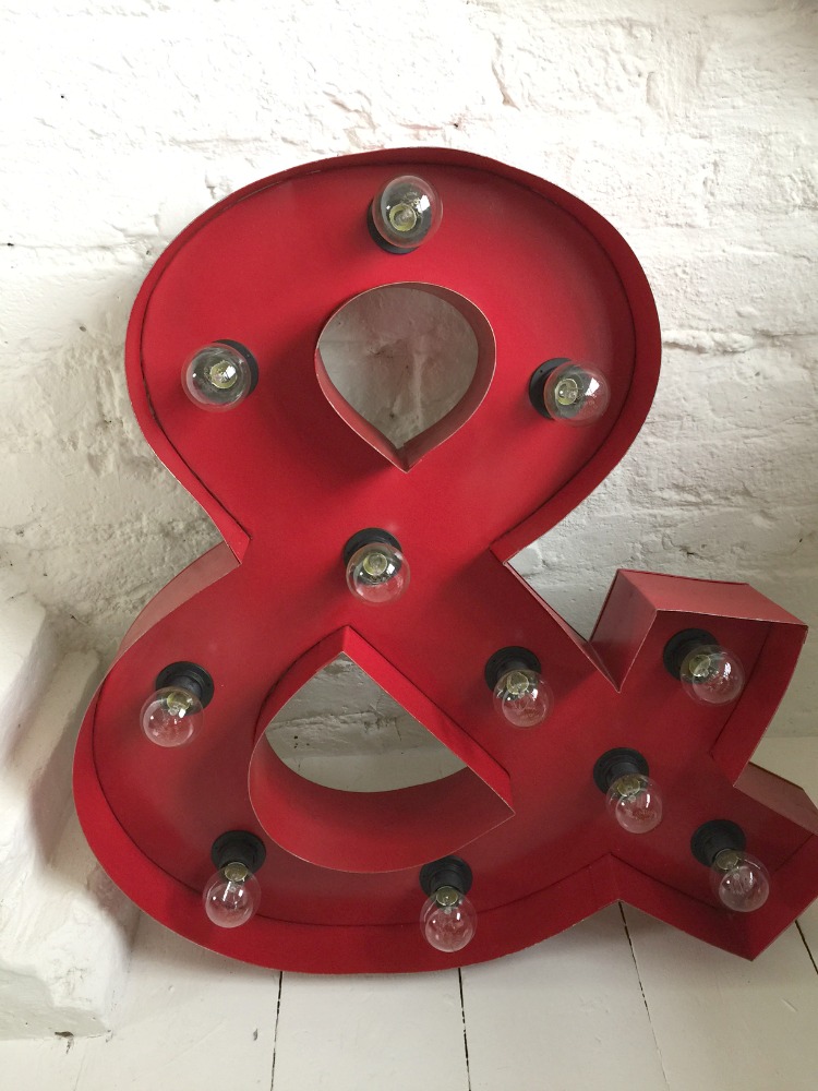 red ampersand light from dwell
