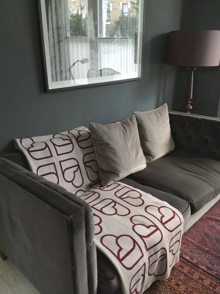 cordello home throw on grey velvet sofa