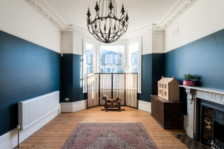 navy-blue-room-with-wooden-floors-via-the-modern-house