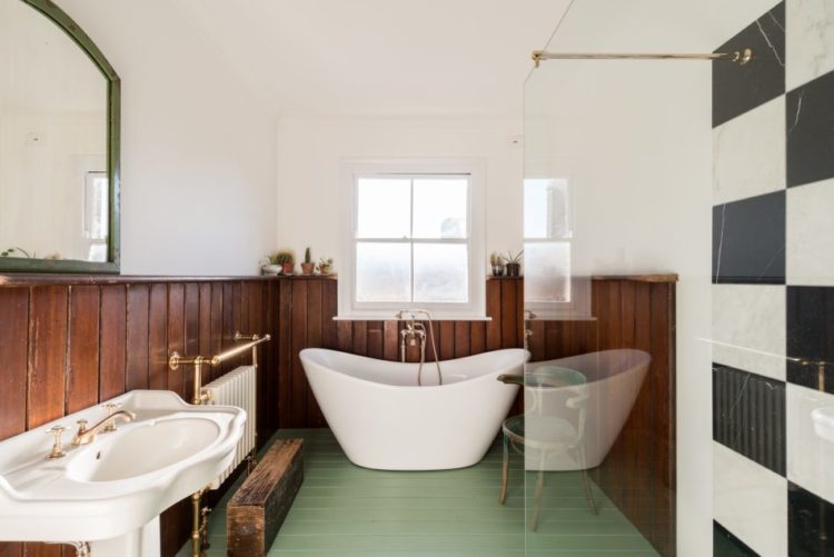 panelled-bathroom-with-green-floor-via-the-modern-house