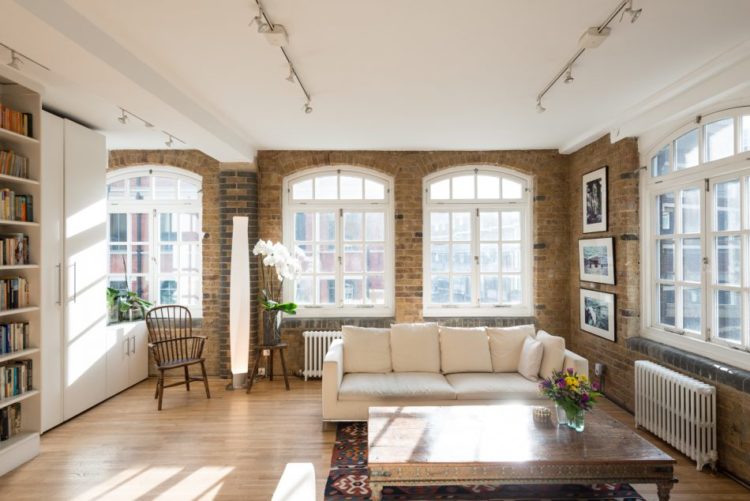 white-sitting-room-exposed-brick-windows