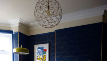navy blue and gold wallpaper set off this pendant light perfectly image by Karen Knox