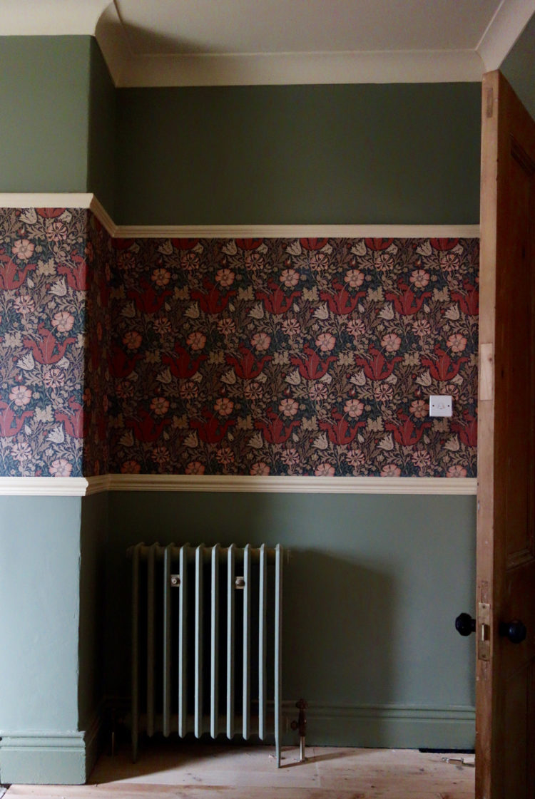 consider replacing ugly radiators room by room or painting them to match the walls
