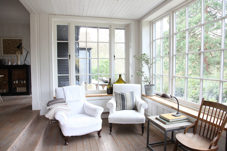 white chairs in garden room via lightlocations