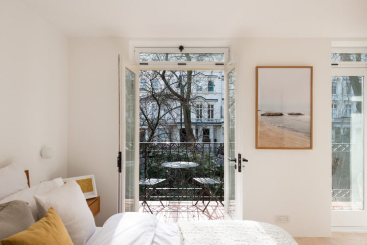 white bedroom with a view