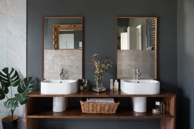 dark grey walls and twin basins bathroom by Paul Craig styled by Kate Watson-Smyth