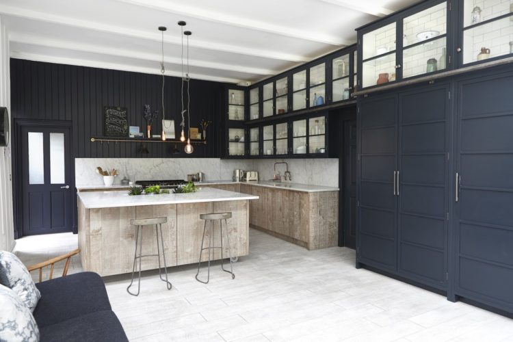 navy blue cupboards and wooden cupboards via shootfactory