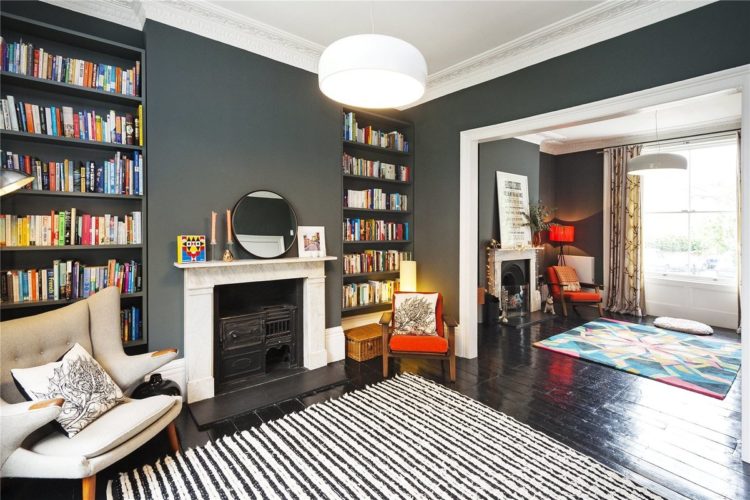 grey sitting room with orange accents