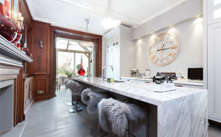 wooden panelling and marble island via savills