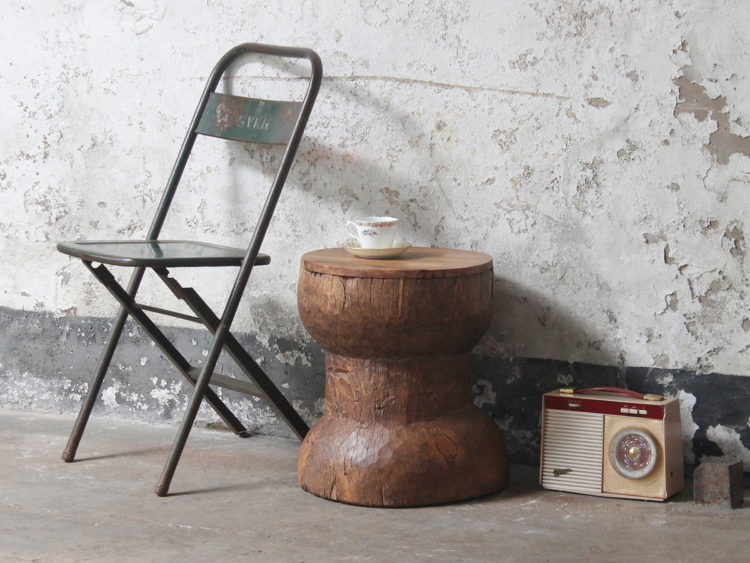 vintage wooden stool from scaramanga doubles up as a bedside table