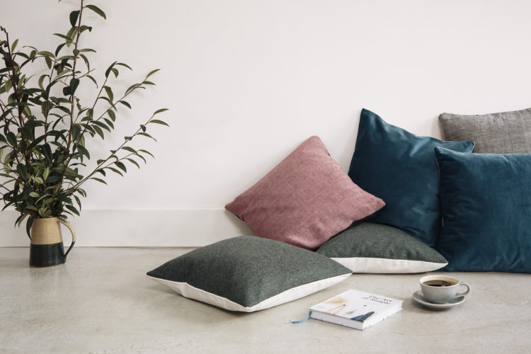 organic cushions sewn by refugee women who have been rehoused in the UK