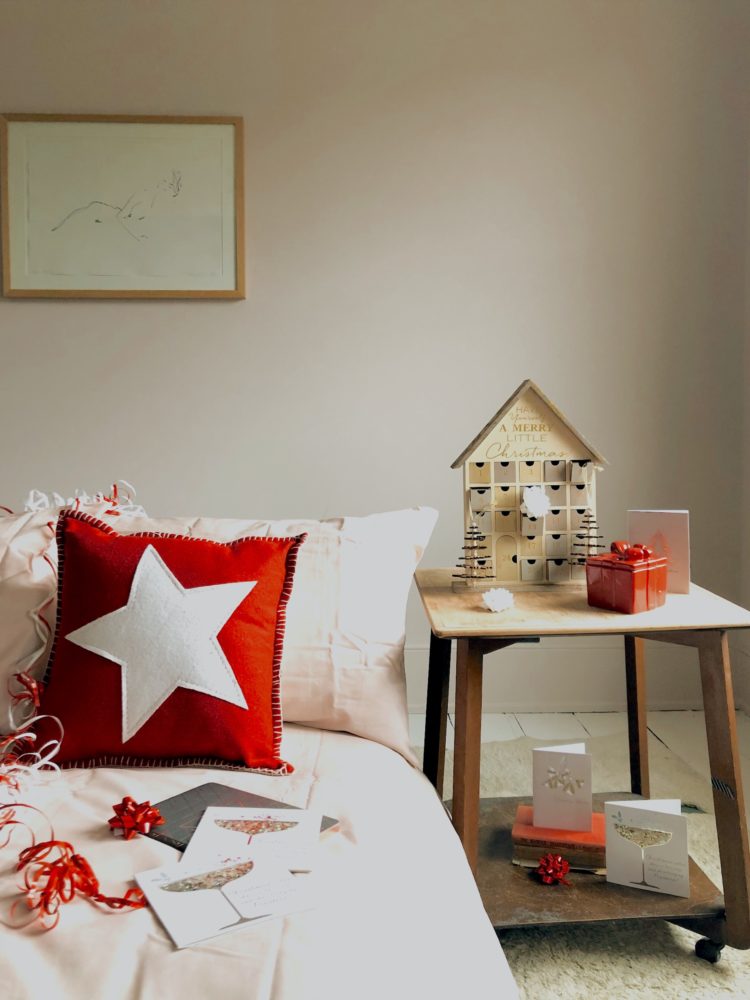 red star cushion £14, prosecco cards, wooden advent calendar, christmas present candle all from next