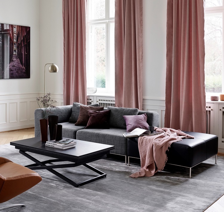 the modern bo concept angular sofa is softened by the textured cover and cushions 