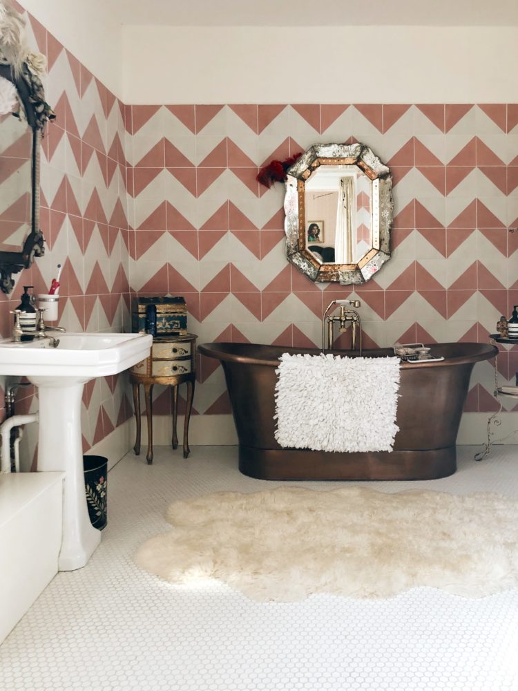 copper bath and pink and white tiles in the home of pearl lowe image by madaboutthehouse.com