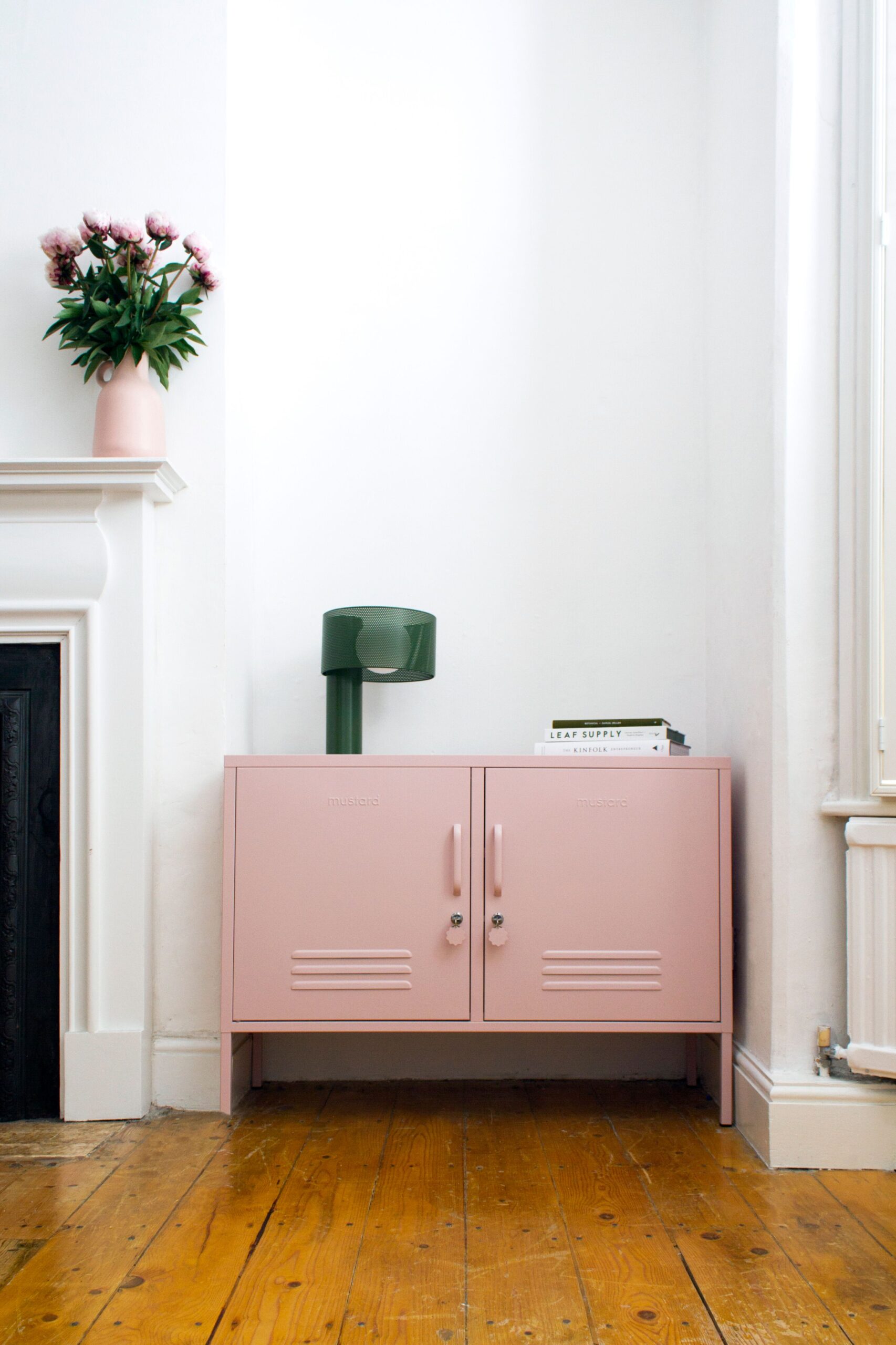 Kate Watson-Smyth discuuses how to put bad lighting right with Helen White, co-founder of Houseof. The green mesh table lamp adds an interesting element and complements the pink metal cabinet. #lighting #tablelamp #madaboutthehouse