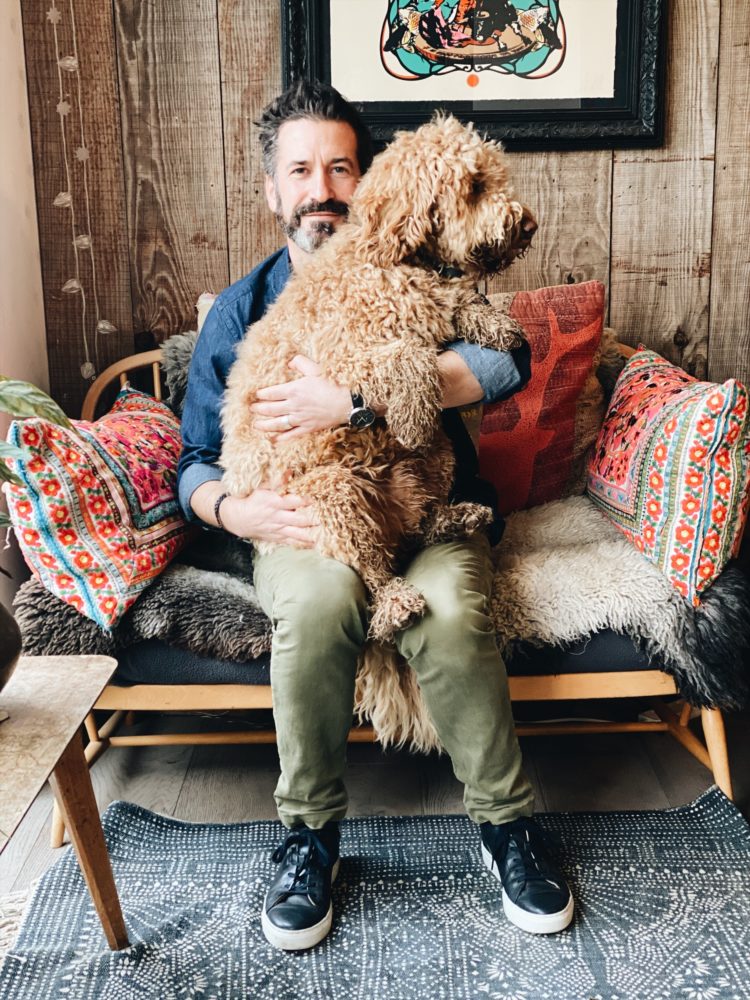 Oliver Heath at home with his dog Zev