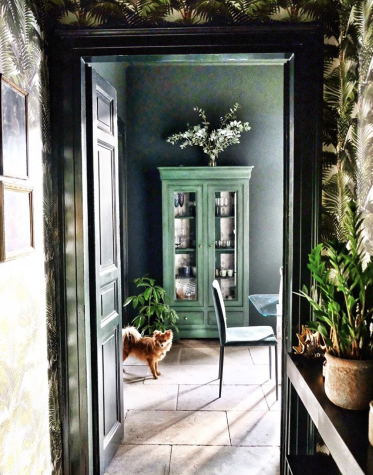 A look at some beautiful rooms with Kate Watson-Smyth. Here the doorway leading into the dining room is painted green which links the space perfectly. A complementing green painted vintage glazed cabinet adds interest too. #greeninterior #madaboutthouse