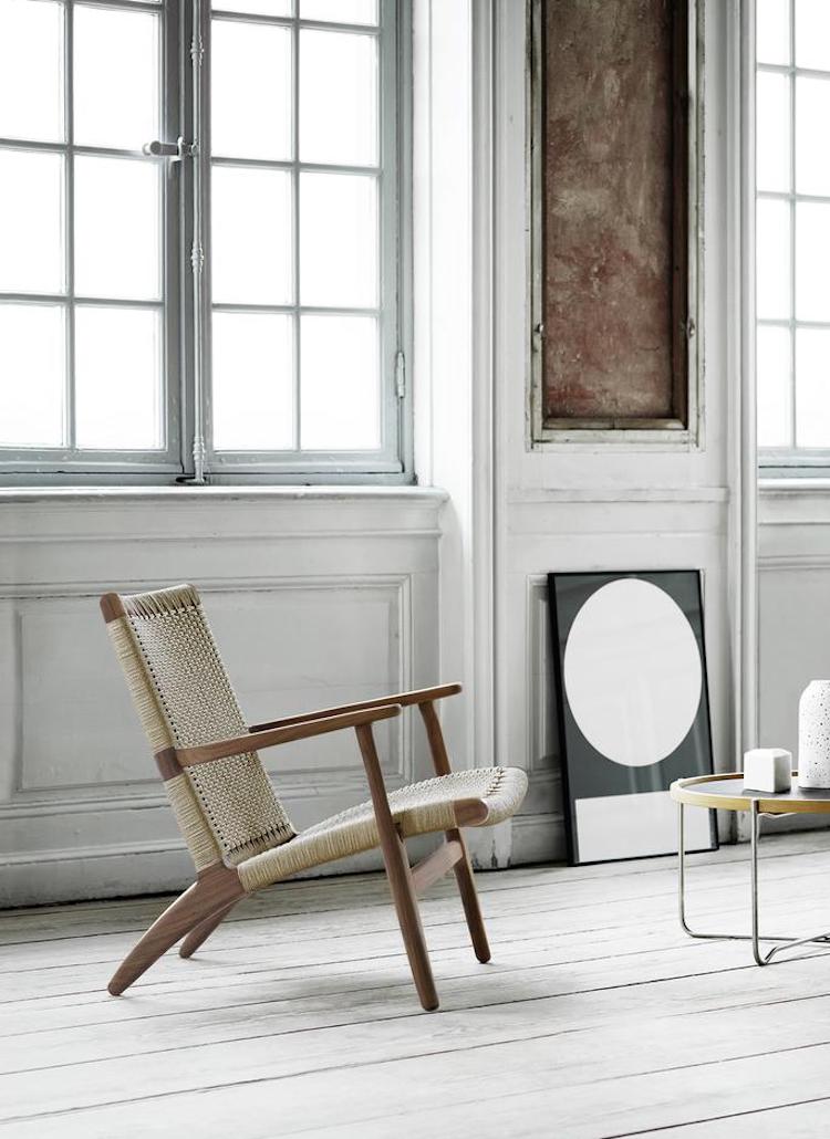 hans wegner's c25 lounge chair has now been re-issued in walnut for the first time