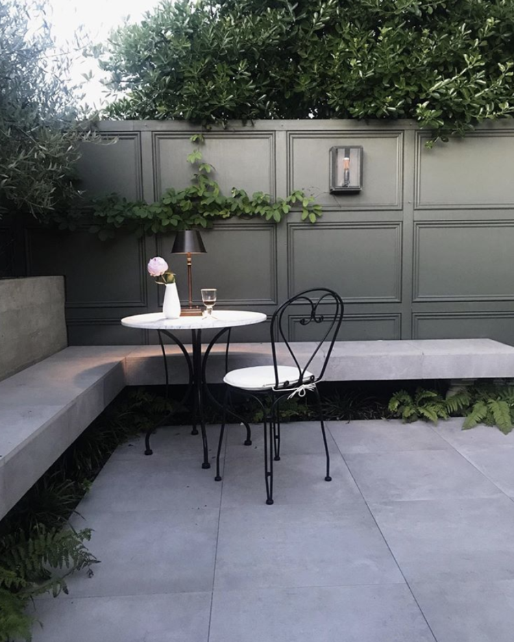 Outside panelling and a Davey Box light: a simple but oh so effective courtyard garden by @homeiswherethepackis. Hand crafted at our Birmingham metalworks,