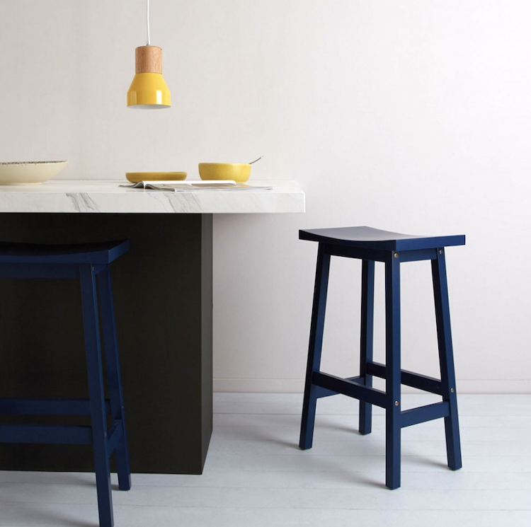 tuck navy blue painted wooden stool from habitat - you can buy any wooden stool and paint to add a flash of colour