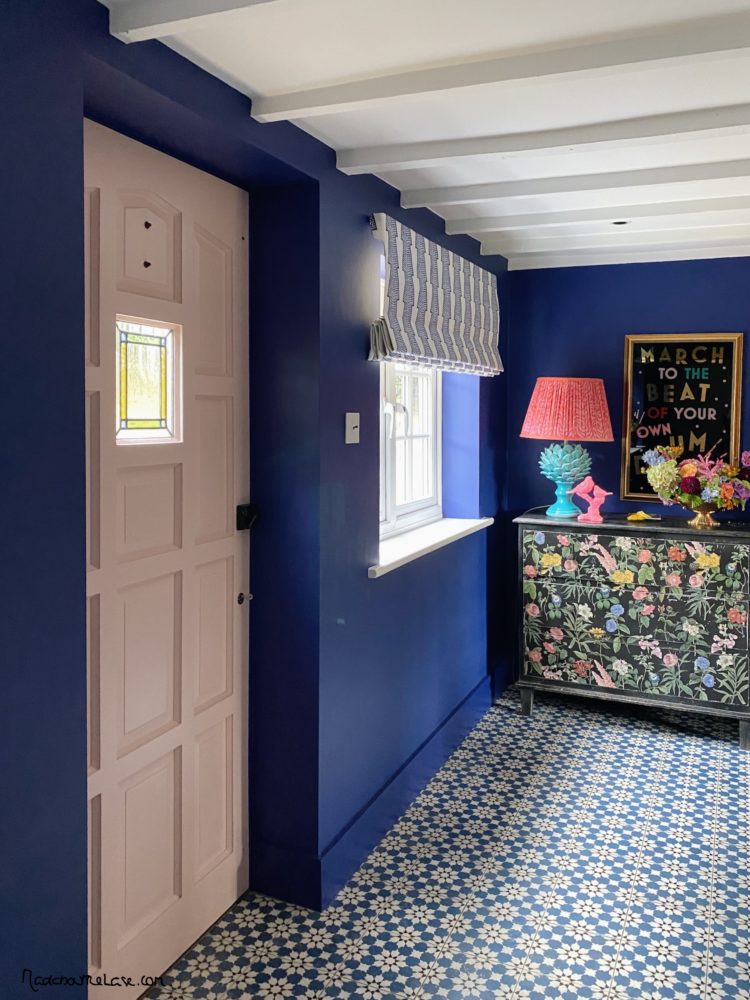 blue walls and pink door in hall at Sophie Robinson house