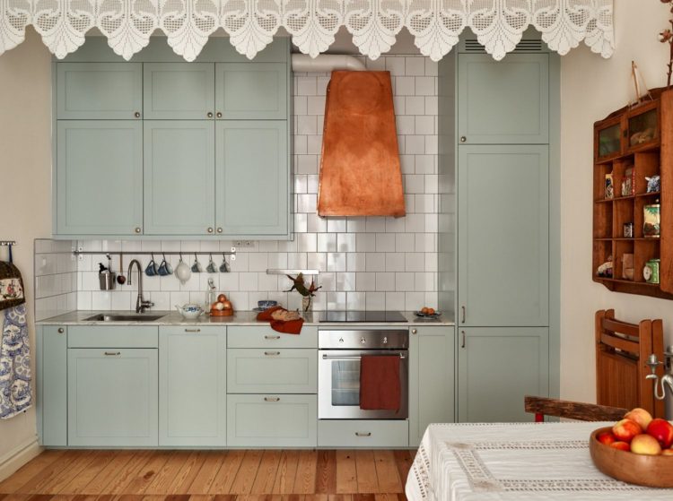 pale blue kitchen with copper hood via historiskahem