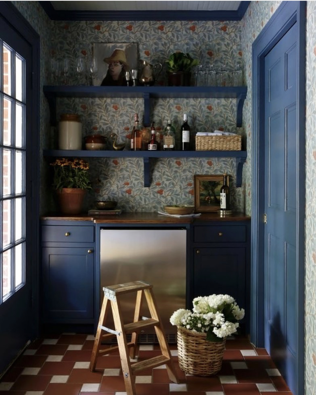 blue cabinet and floral wallpaper by @sabbeinteriordesign