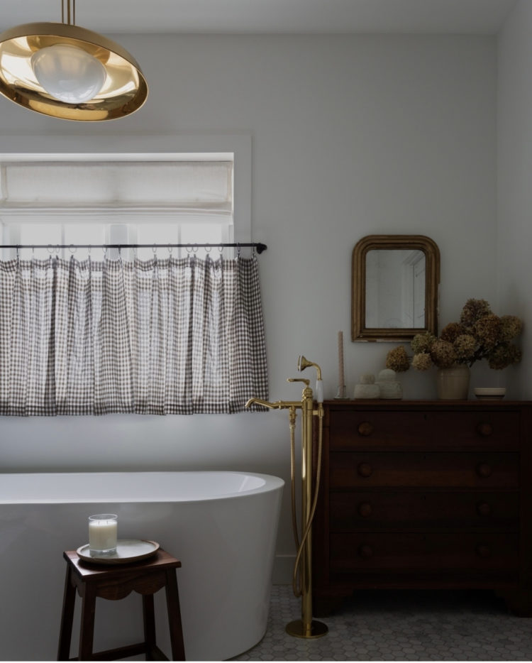 cafe curtain over freestanding bath via light and dwell interiors photographed by amy bartlam